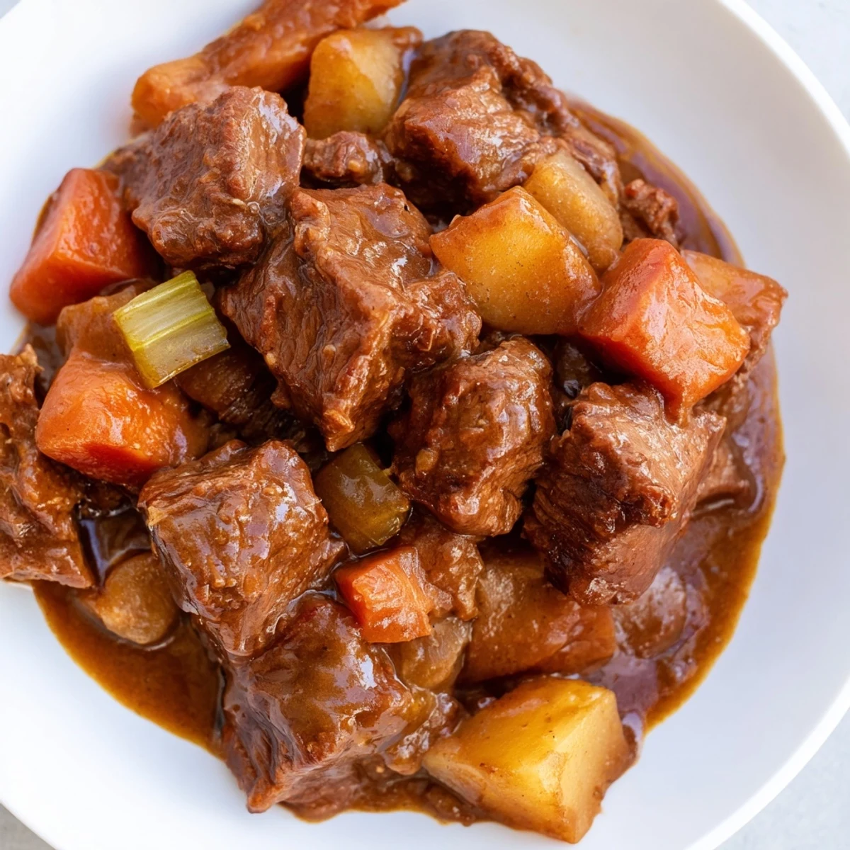 Hearty slow cooker beef stew with root vegetables steaming next to crusty bread and fresh thyme on a linen placemat.