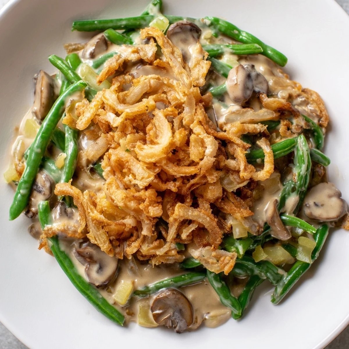 Steaming Green Bean Casserole with Crispy Onions fresh from the oven, perfect for a holiday table next to roast turkey or ham.