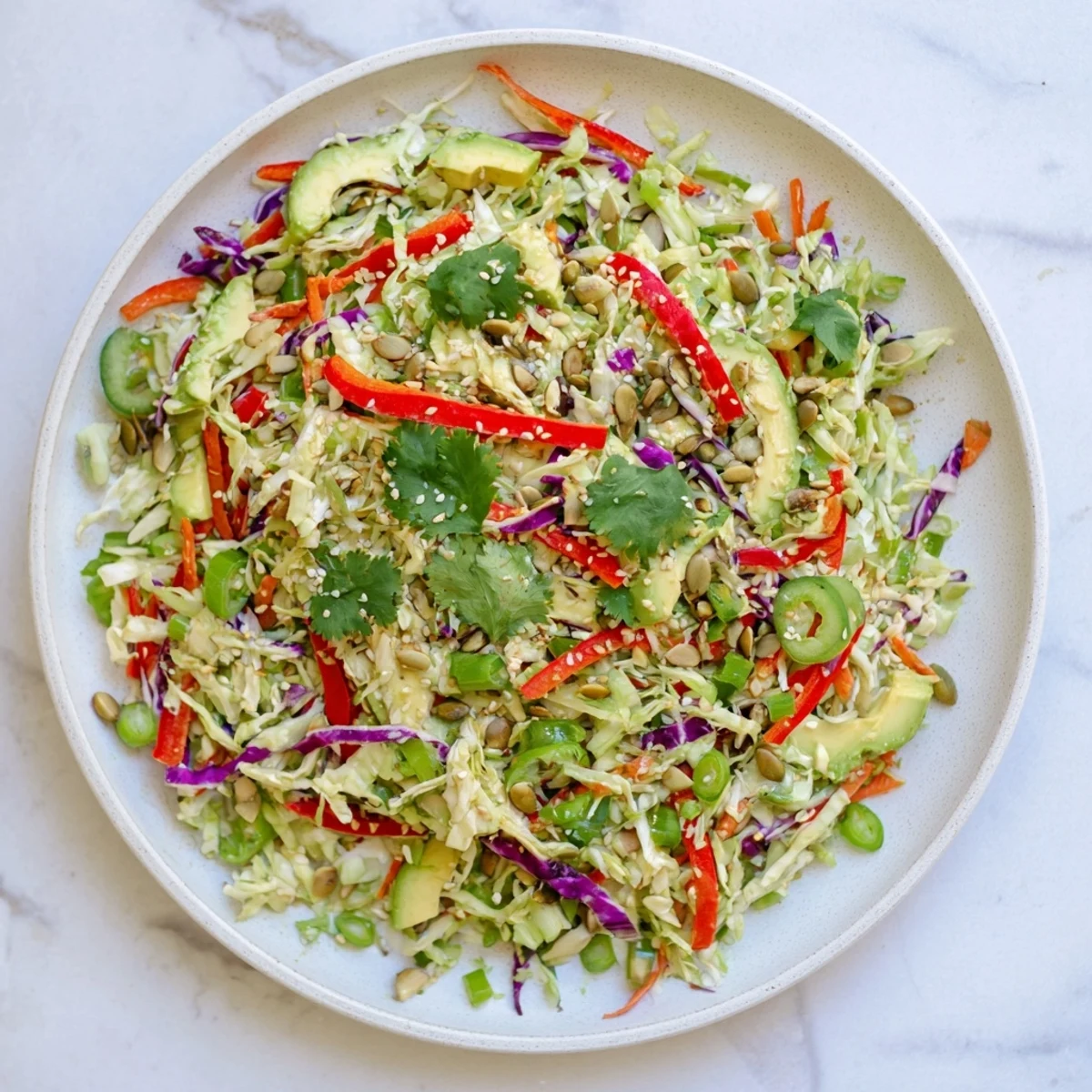 Serving suggestion for Avocado Cabbage Salad featuring bright colors and textures, perfect for a healthy vegan lunch.