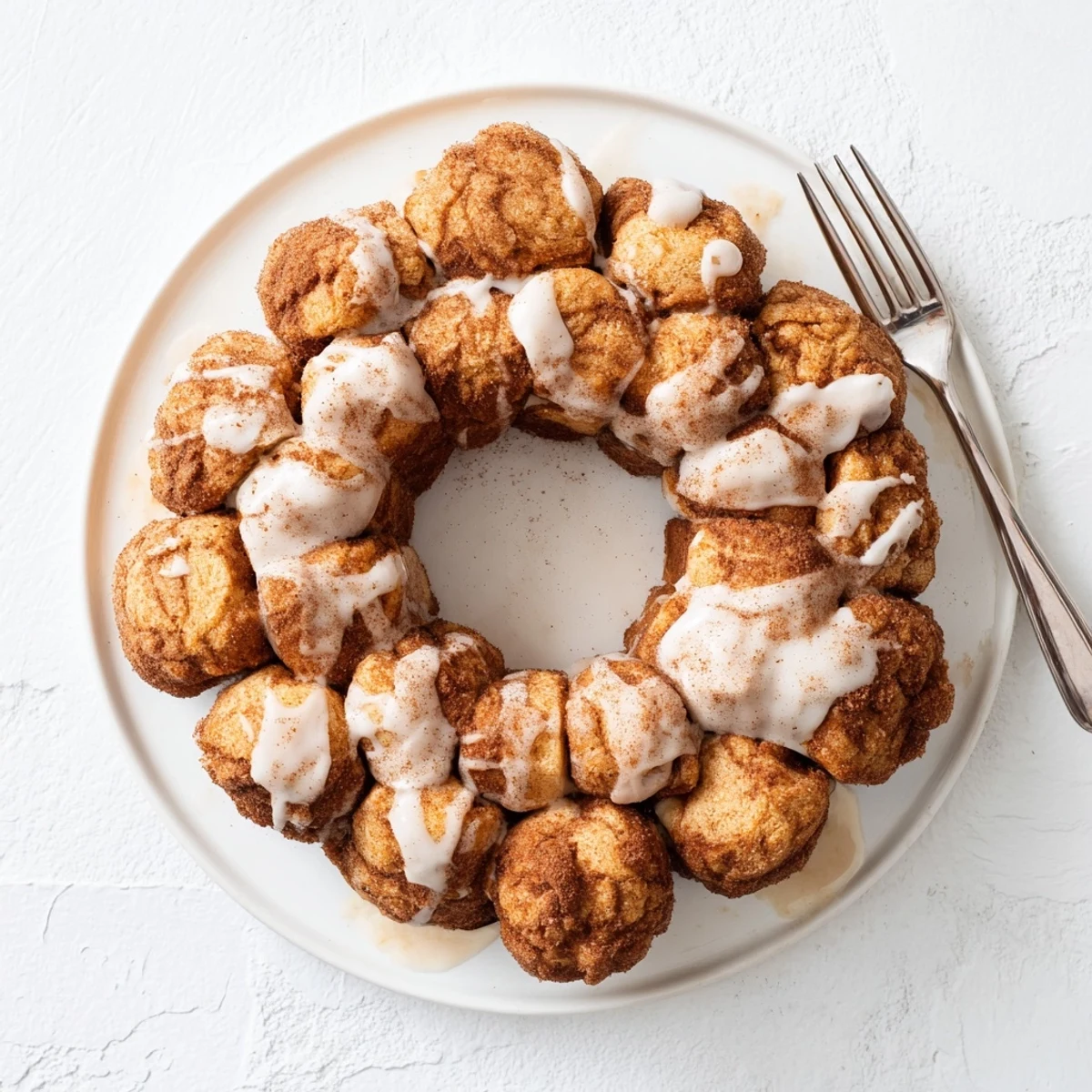 Warm high protein no sugar monkey bread pieces coated in buttery cinnamon sugar mixture