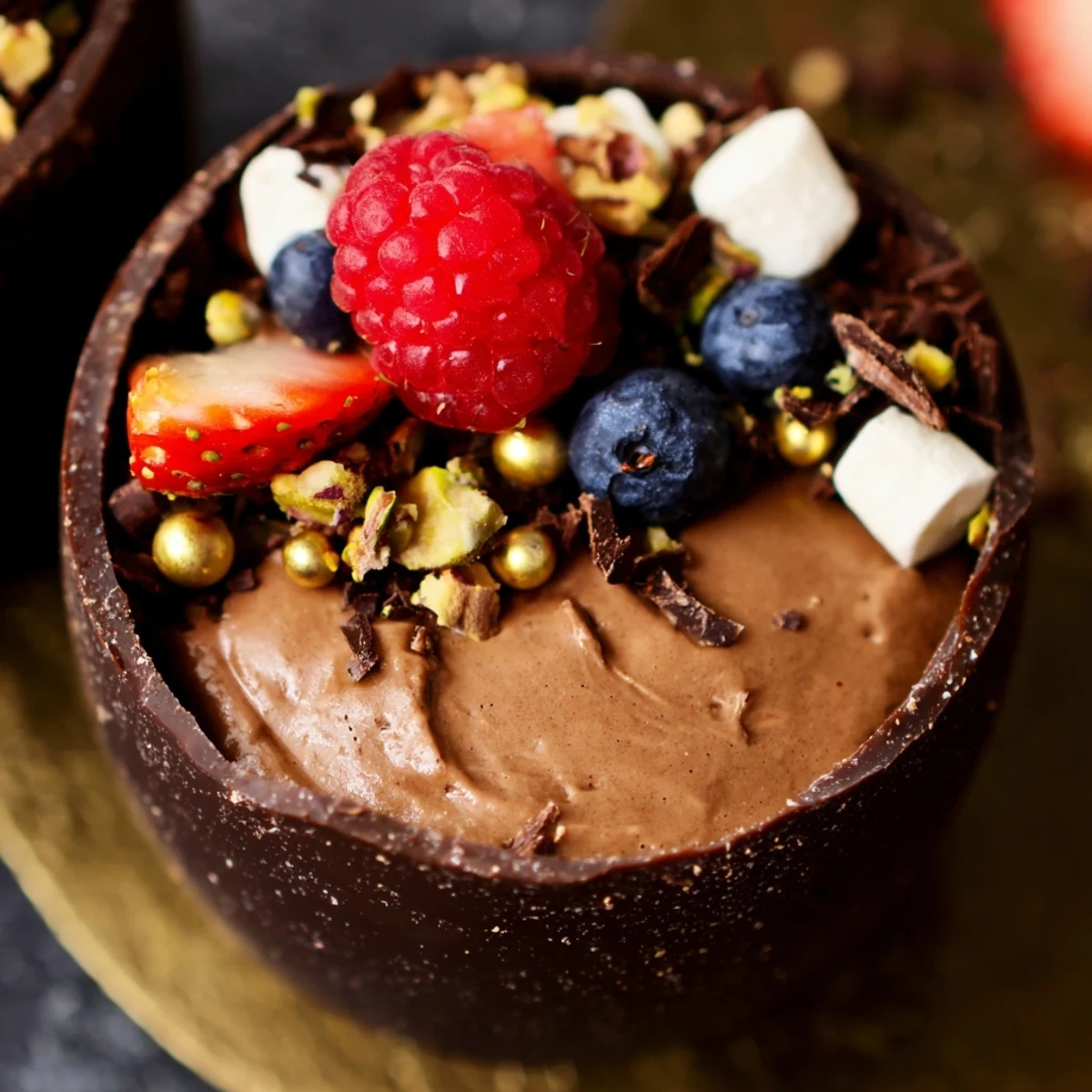 Elegant chocolate grazing cups filled with fluffy mousse and topped with fresh berries and nuts