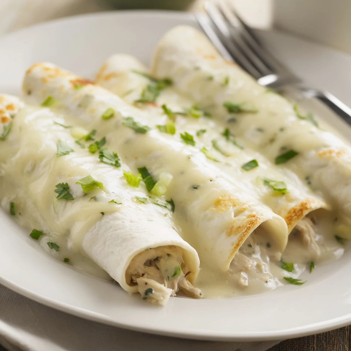 Family style Creamy White Chicken Enchiladas sliced, steam rising, served with Spanish rice