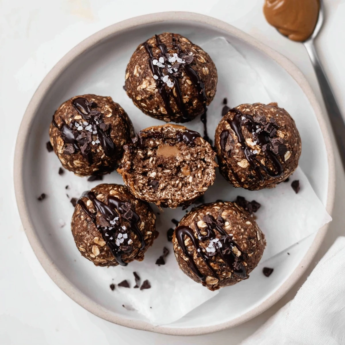 Brownie Protein Bites, rich and fudgy, chilled on parchment for snacking
