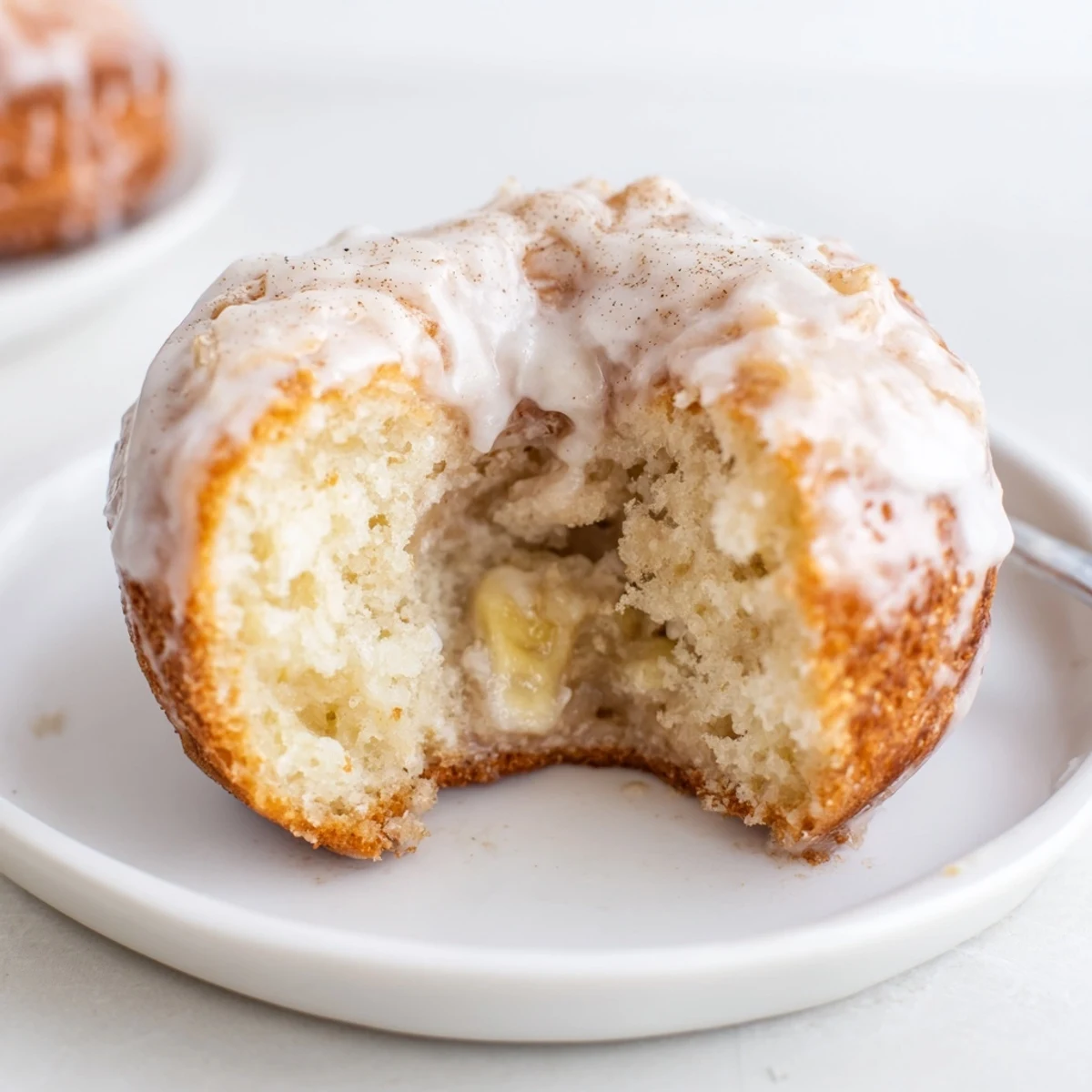 Banana Donuts with golden crust and moist crumb cooling on wire rack