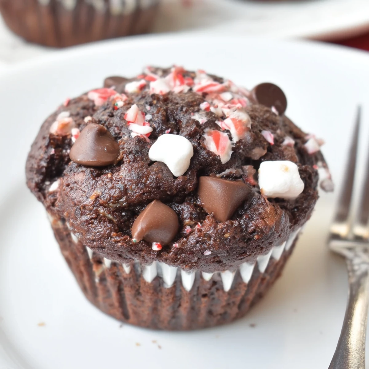 Warm Peppermint Hot Chocolate Muffins steaming on a rack, chocolate chips glistening  