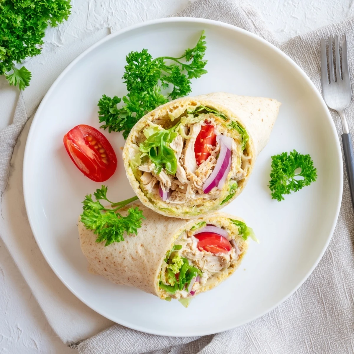 Golden high protein crispy cottage cheese flatbread chicken wraps with fresh lettuce and juicy seasoned chicken