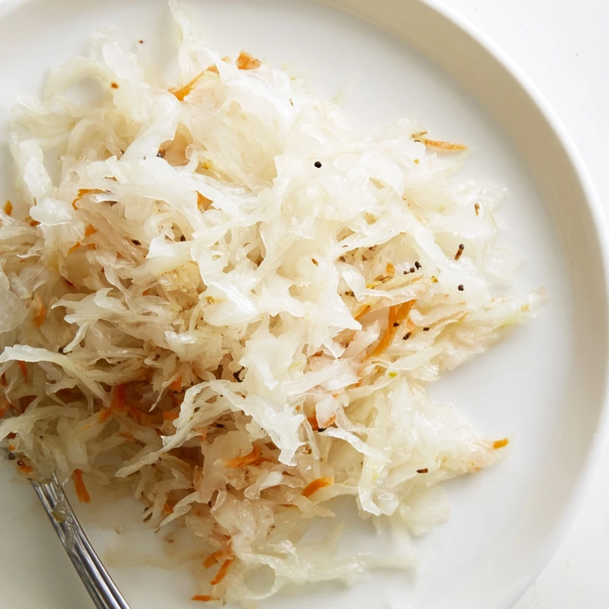 Fresh naturally fermented sauerkraut topped with juniper berries and aromatic spices