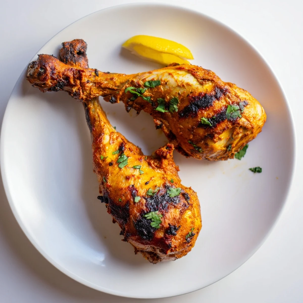 Juicy Tandoori Chicken marinated in yogurt and spices, served with warm naan