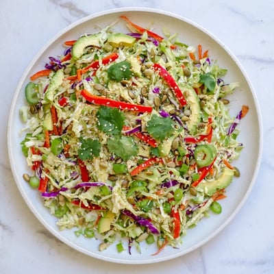 Serving suggestion for Avocado Cabbage Salad featuring bright colors and textures, perfect for a healthy vegan lunch.